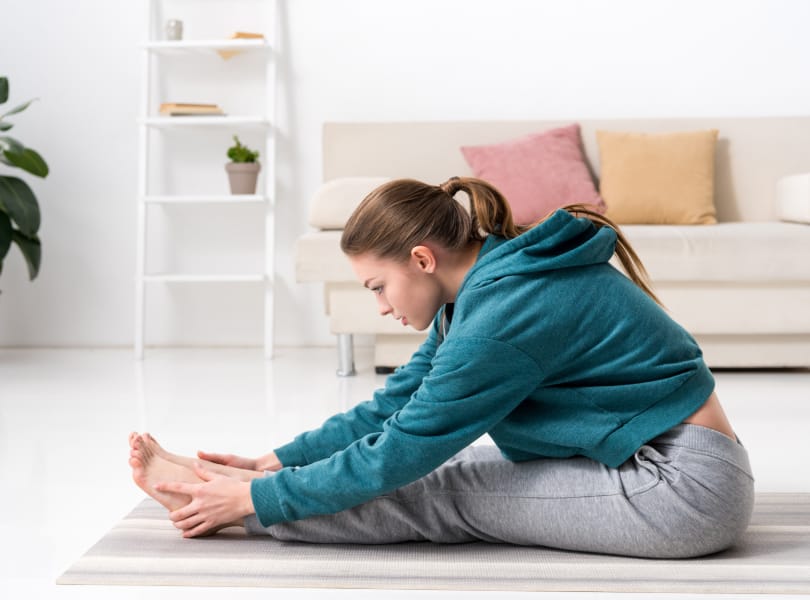 female stretching home